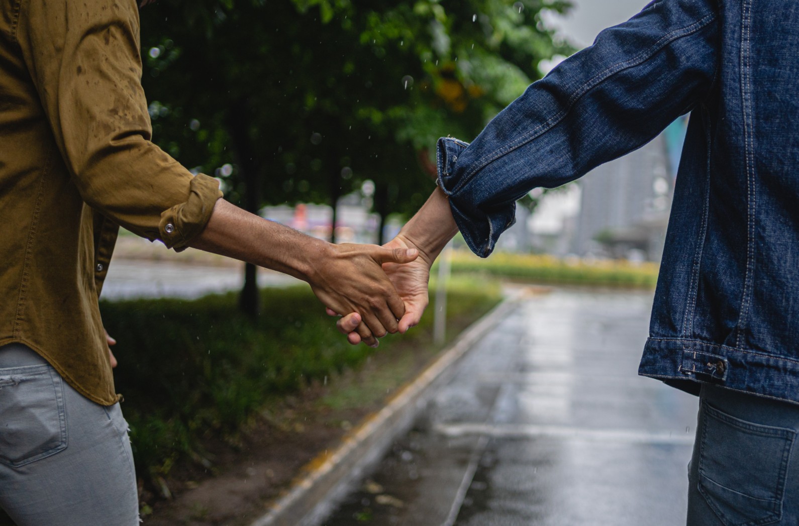 Two people holding hands