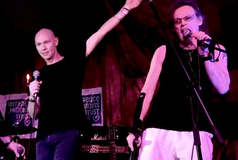 David Bowie fan charity event with men on stage singing David Bowie fan charity event with men on stage singing