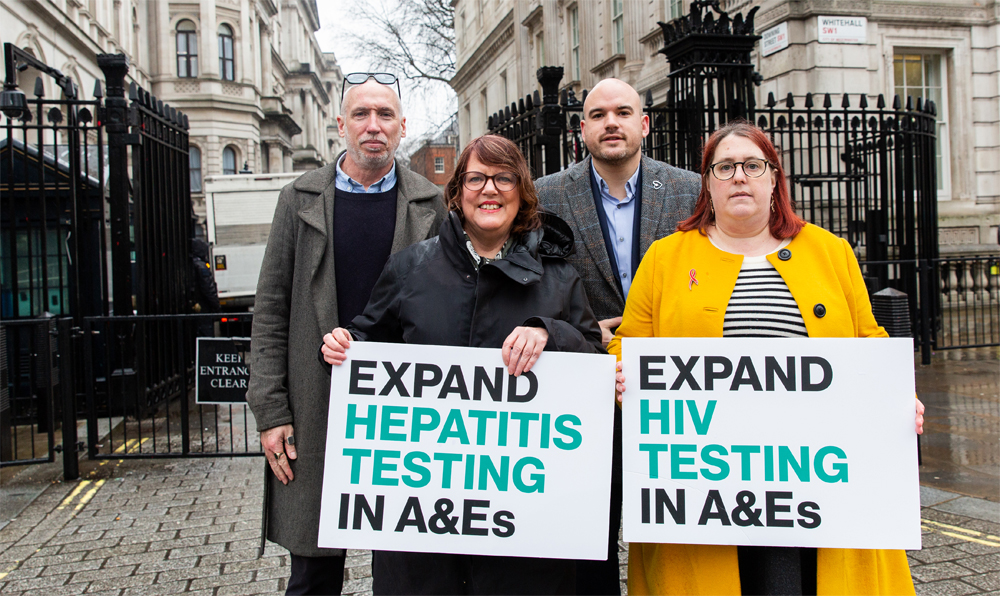 Stuart Smith, Vanessa Hebditch, Richard Angell and Deborah Gold holding signs saying 'Expand hepatitis testing in A&Es' and 'Expand HIV testing in A&Es' outside Downing Street. Stuart Smith, Vanessa Hebditch, Richard Angell and Deborah Gold holding signs saying 'Expand hepatitis testing in A&Es' and 'Expand HIV testing in A&Es' outside Downing Street.