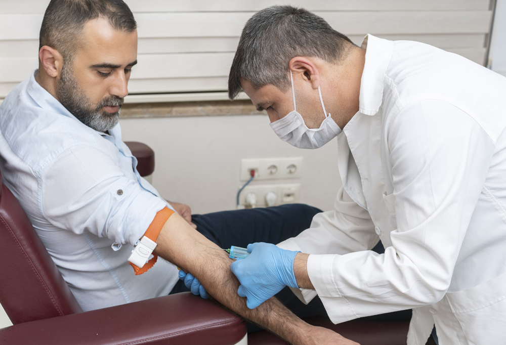 Doctor injecting into patient arm