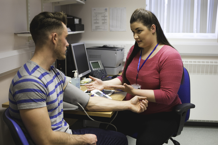 Healthcare professional with patient Healthcare professional with patient