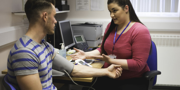 Healthcare professional with patient Healthcare professional with patient