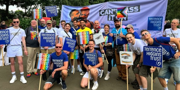 The cast of season two of I Kissed a Boy with Terrence Higgins Trust placards at London Pride.