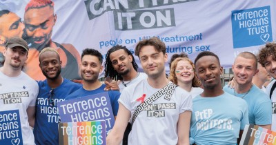 Adam from I Kissed a Boy and a group of people and Can't Pass It On banner