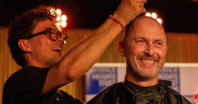 A Terrence Higgins Trust supporter have their head shaved on stage at the Royal Vauxhall Tavern.