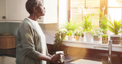 Woman standing at sink