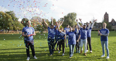 Ribbon Walk London walkers celebrating in field Ribbon Walk London walkers celebrating in field