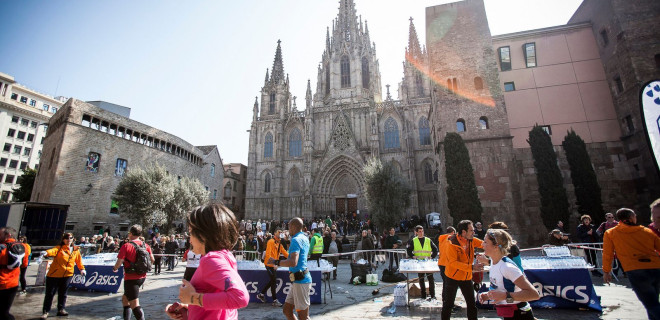 Support stands in front of a cathedral for a marathon in Barcelona.