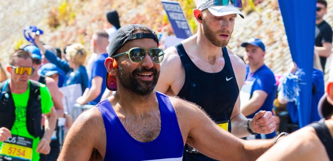 A Terrence Higgins Trust runner with sunglasses during the London Marathon.