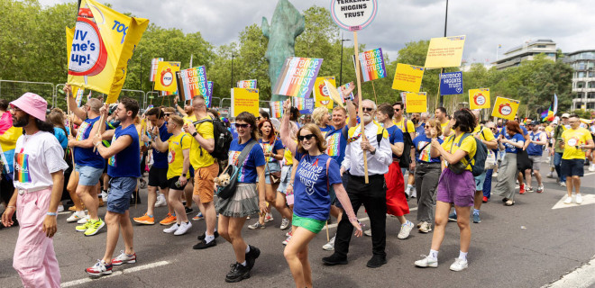 Terrence Higgins Trust representatives in a Pride Parade.