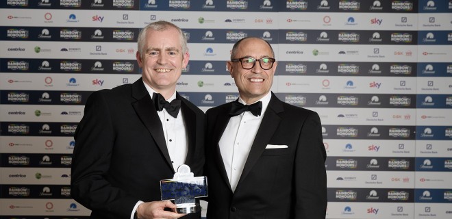 Eugene Lynch and Dominic Edwardes stand in receipt of an award at the Rainbow Honours.