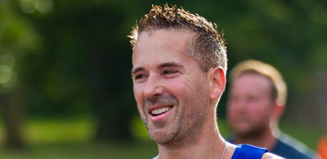 A smiling Terrence Higgins Trust London Marathon runner.