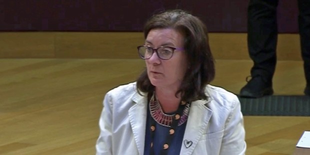 Health Minister Eluned Morgan sat at desk