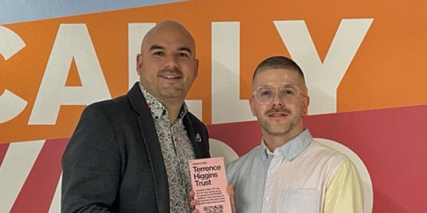 Richard Angell receiving pink plaque from Seán McGovern at Cally Yard