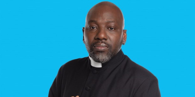 Reverend Jide Macaulay against a blue background.