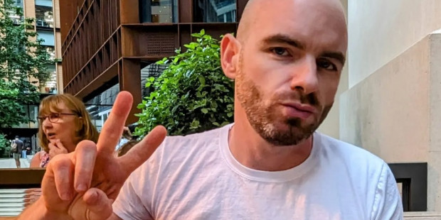 Liam wearing T-Shirt with one of two artworks by Amog Lux to mark their trip