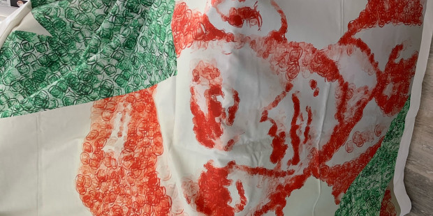 Terry Higgins AIDS Memorial Quilt panel portrait of Terry stamped in red and green