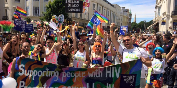Crowd of people behind banner at Brighton Pride