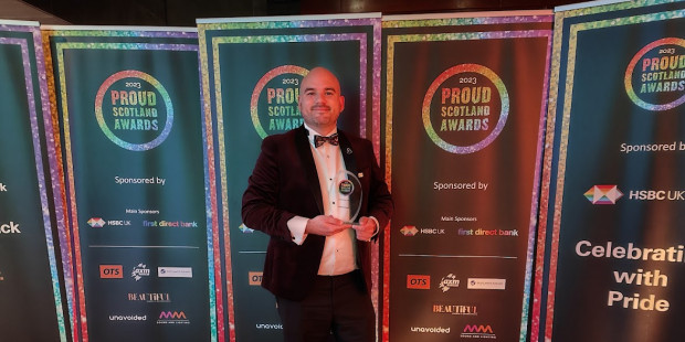 Richard Angell holding a Proud Scotland 2023 Leadership Award