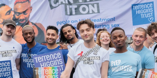 Adam from I Kissed a Boy and a group of people and Can't Pass It On banner