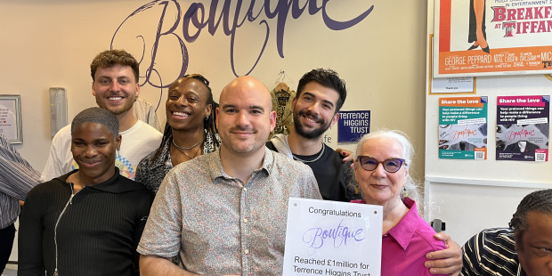 Boutique raises £1m. Chief Executive Richard Angell holds a sign congratulating the boutique with the cast of I Kissed A Boy.