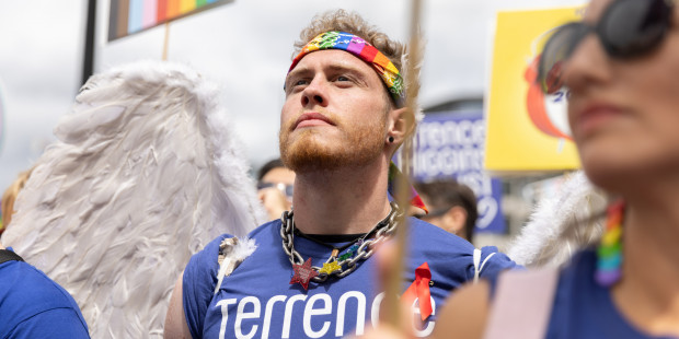 Jake Devline-Reed at Pride 2023 in blue Terrence Higgins Trust shirt