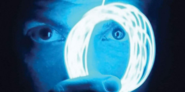 Jarman show poster detail of man and glowing loop