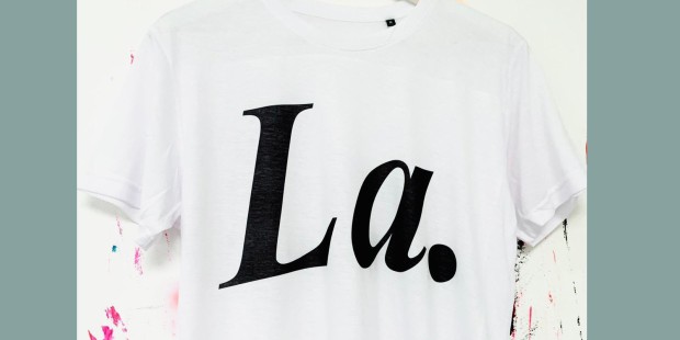 White T-shirt with 'La' black text on hanger