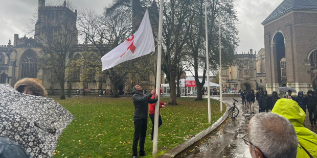Marvin Rees putting up flag in Bristol