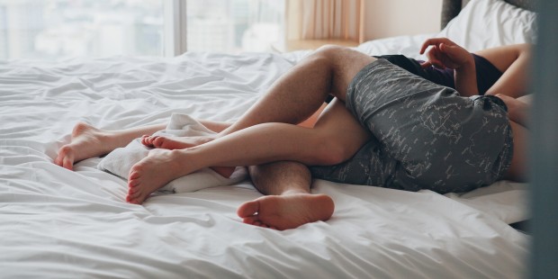 Couple legs intertwined